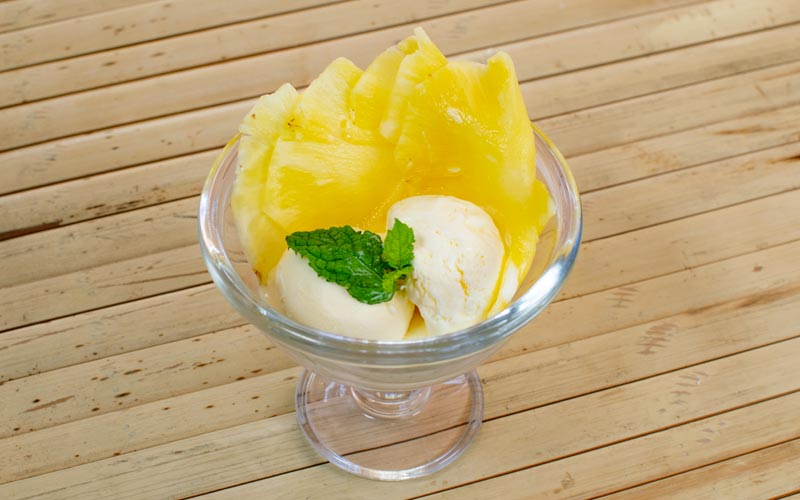 PalmBeach Tropical Restaurant | Ananas con Gelato | a refreshing pineapple carpaccio, served with a scoop of vanilla ice cream and a sprig of mint