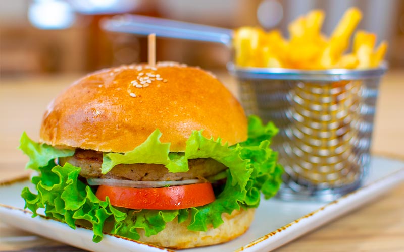 PalmBeach Tropical Restaurant | Our Artisanal Fish Burger | grilled on natural charcoal and served with french fries