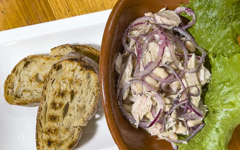 PalmBeach Tropical Restaurant | Homemade Salad | homemade tuna in oil with red onions, white beans and toasted bread croutons