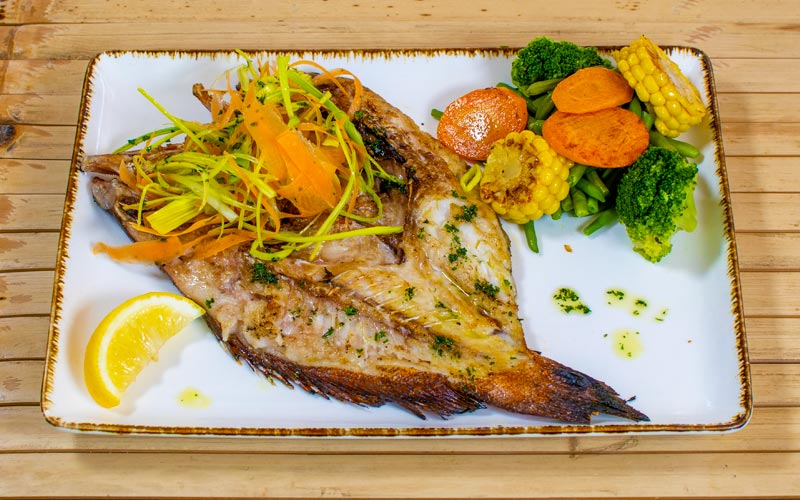 PalmBeach Tropical Restaurant | Grilled Fresh Fish | fish of the day grilled on a natural charcoal grill, served with grilled mixed vegetables
