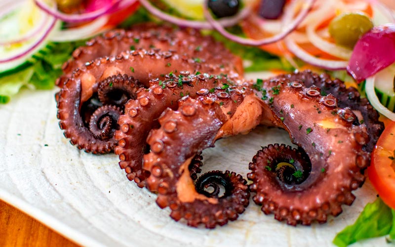 PalmBeach Tropical Restaurant | Grilled Octopus | cooked on a natural charcoal grill, accompanied by a mixed vegetables
