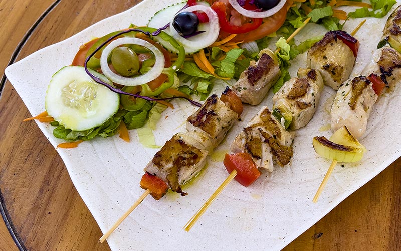 PalmBeach Tropical Restaurant | Skewers of Fish of the Day and Mixed Vegetables | skewers grilled over natural charcoal, served with mixed salad