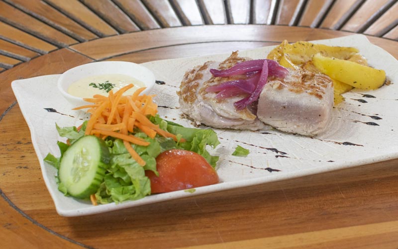 PalmBeach Tropical Restaurant | Tuna with Mango | grilled tuna steak on natural charcoal, mango pulp, caramelized red onion, served with mixed salad and baked potatoes